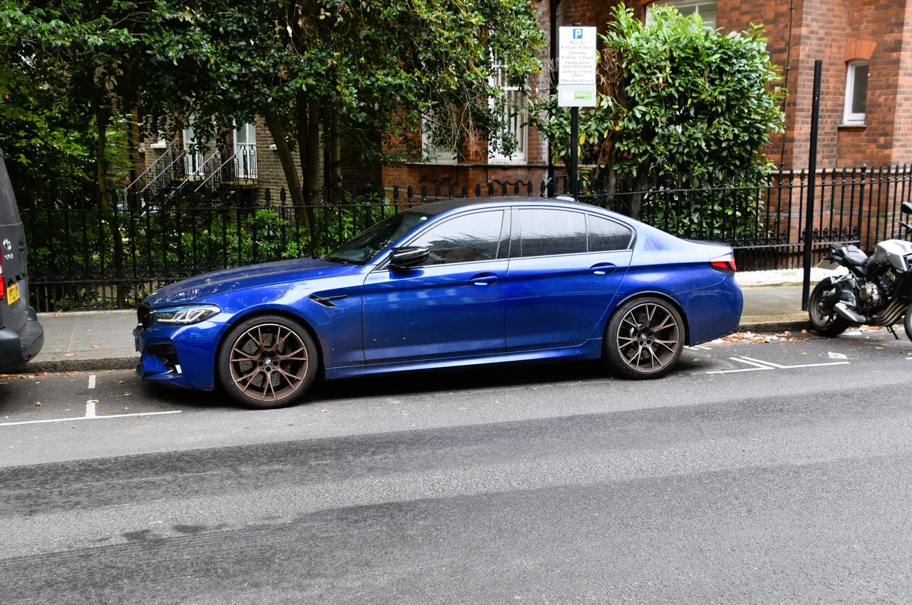 Blue BMW M5 Competition parked on a London street
